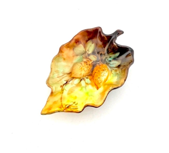 Hand-painted porcelain leaf-shaped dish in autumn golds and browns with gooseberries