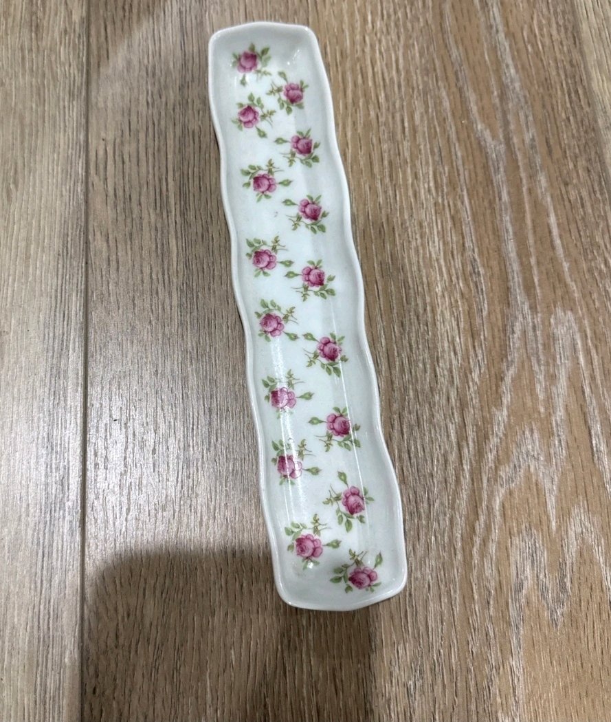 Long narrow porcelain tray scattered with small pink rosebuds