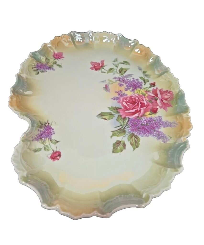 Scalloped porcelain dish with lustre border, decorated with pink roses and purple lilacs