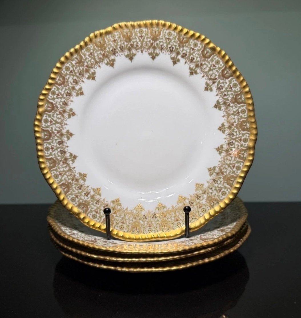 Gold encrusted porcelain dinner plates